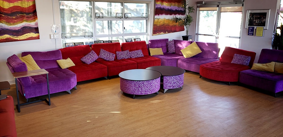 1 of 4, Women's Center Living Room with colorful comfy couches and other seating - UC San Diego