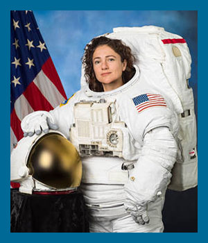 Photo portrait of Jessica Meir wearing a NASA spacesuit